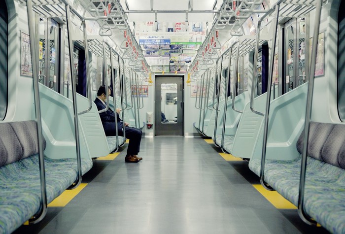 Man sitting in a train in Japan