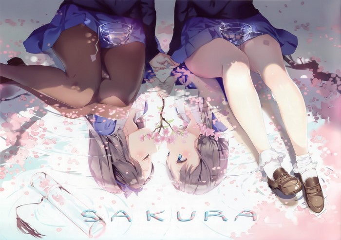 Two girls in school uniforms lying down with cherry blossoms