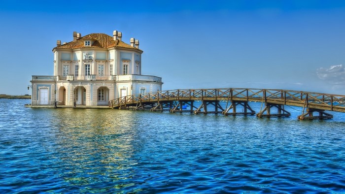 Casina Vanvitelliana on Lake Fusaro with wooden bridge