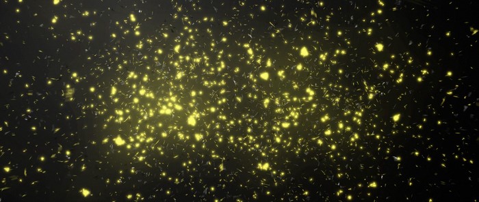 Abstract glowing yellow particles and shards
