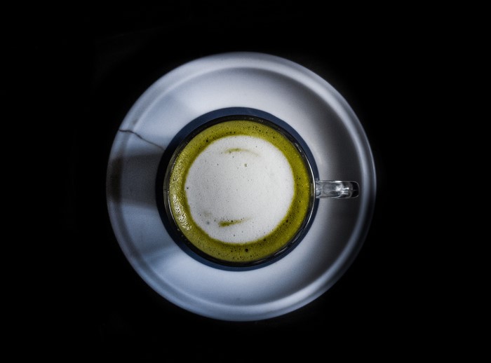 Matcha tea in a cup on a saucer