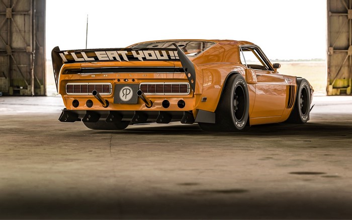 Orange Ford Shelby GT500 with large spoiler