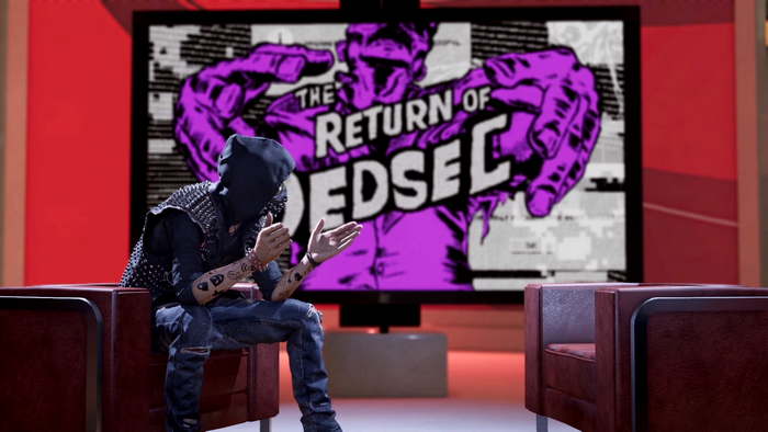 DedSec member from Watch Dogs sitting in front of a screen