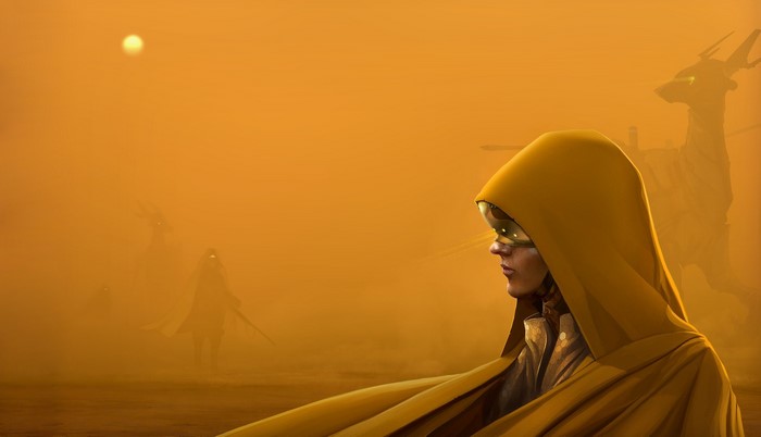 Woman in yellow hood and goggles in a sandstorm