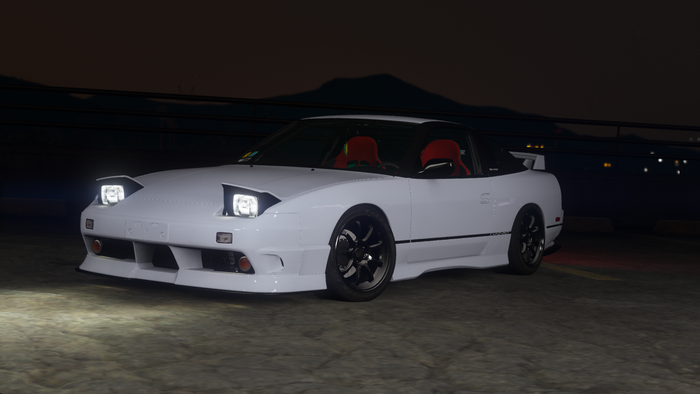 White Nissan 180SX with pop-up headlights at night