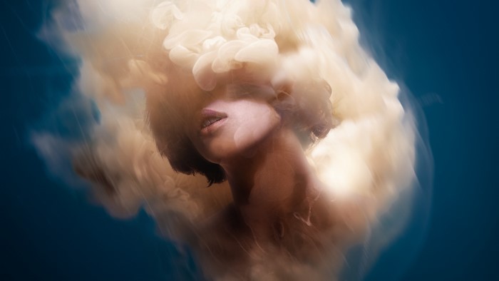 Woman's face emerging from smoke