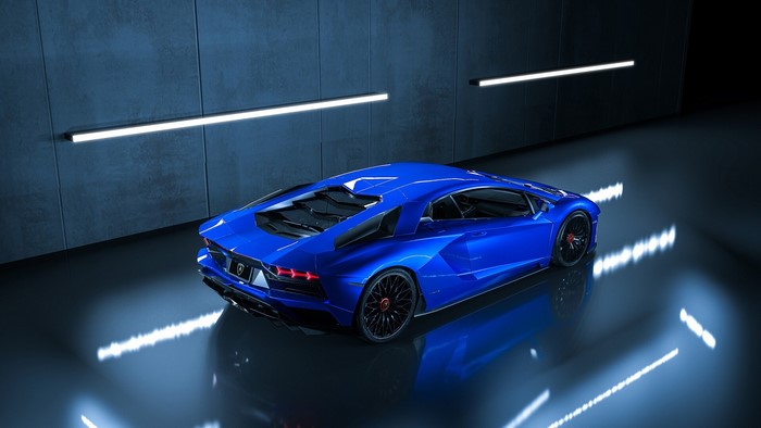 Blue Lamborghini Aventador in a dark garage