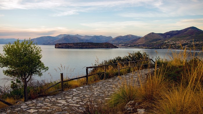 Landscape of Isola di Dino, Calabria, Italy with a stone path and fence
