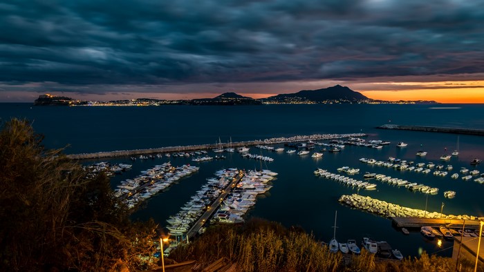 Marina at Dusk with Distant Islands and Lights