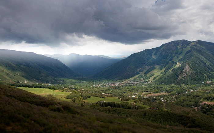 Valley with Mountains and Stormy Clouds