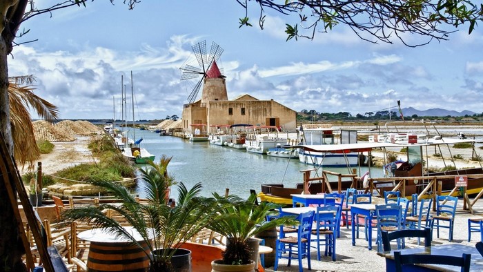 Windmill and boats in Marsala, Sicily, Italy