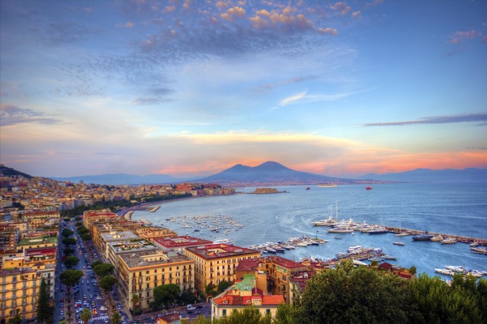 Naples cityscape with Mount Vesuvius and the bay at sunset