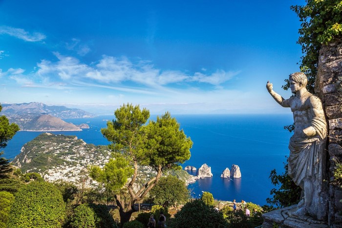 Statue overlooking the sea village of Capri, Italy