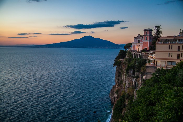 Sunset over Mount Vesuvius from a cliffside church in Campania, Italy