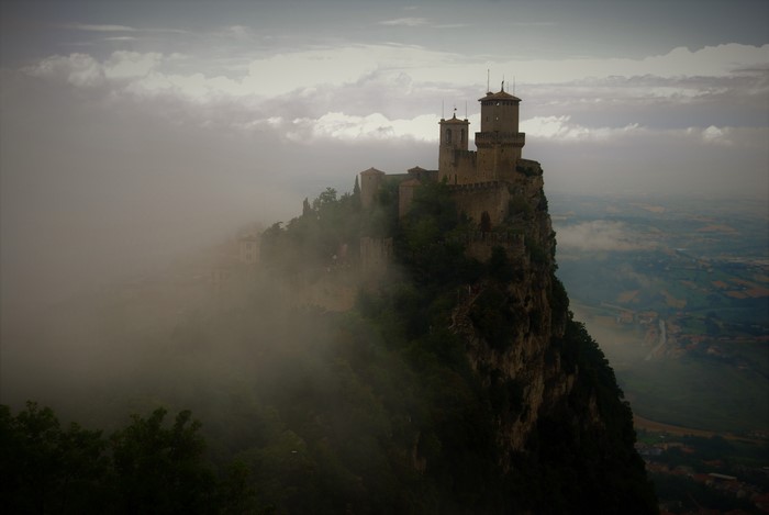 Castle on a cliff in San Marino with clouds