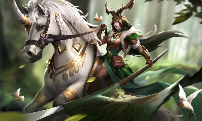 Fantasy girl riding a unicorn in a forest