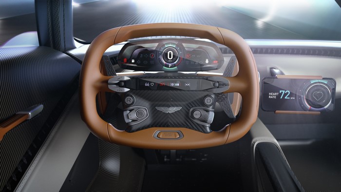Aston Martin car interior with steering wheel and digital displays