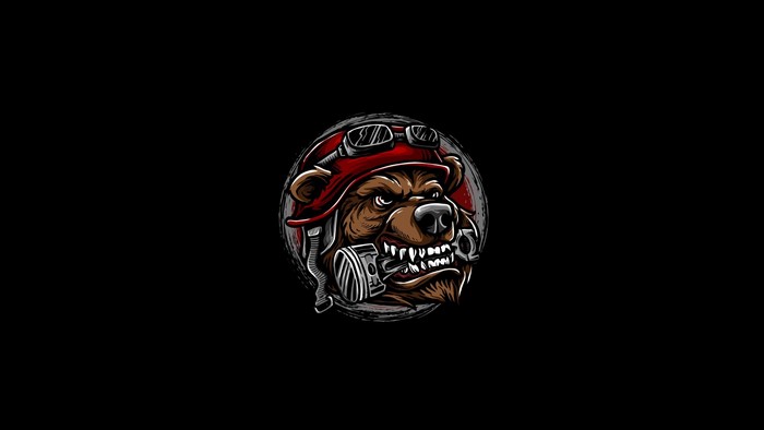 Bear wearing a red helmet and goggles with a piston in its mouth
