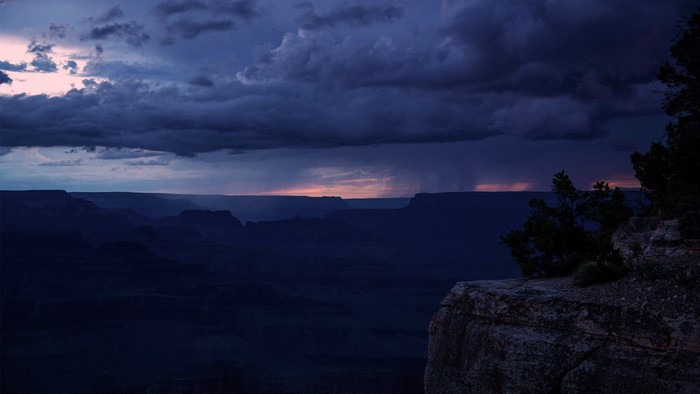 Grand Canyon landscape with storm clouds at dusk
