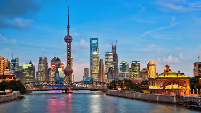 Shanghai cityscape with Oriental Pearl Tower and skyscrapers over river
