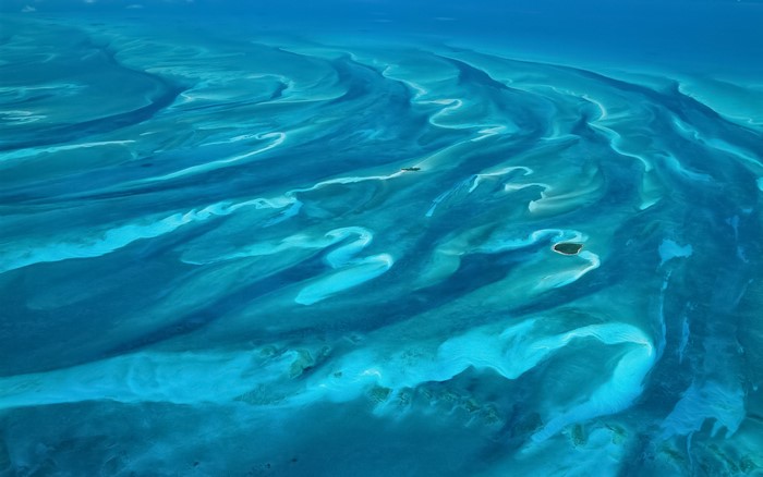 Aerial view of turquoise water and sandbars in the Bahamas