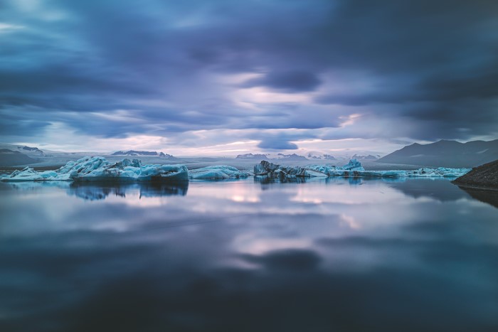 Icebergs floating in a lake in Iceland at sunset