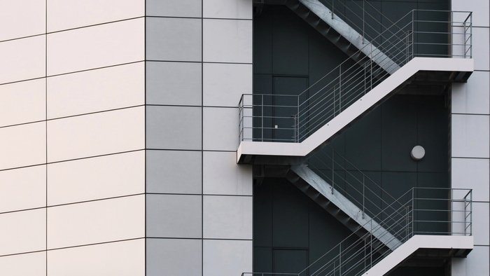 Modern building with external metal fire escape stairs