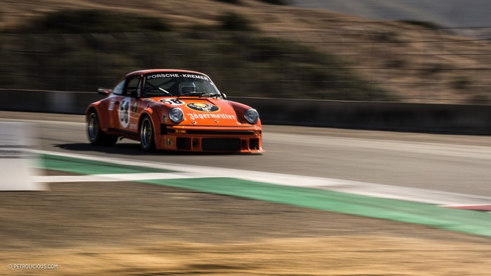 Orange Porsche 911 Kremer Jägermeister race car on track