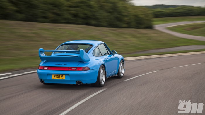 Blue Porsche 911 Carrera RS 9 on a Track