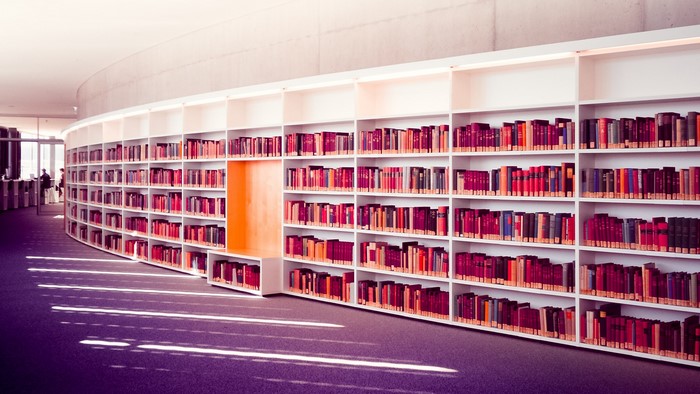 Curved library bookshelves filled with books