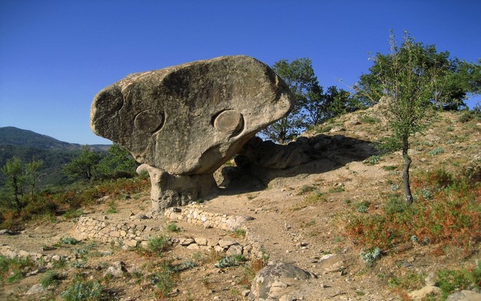 Balancing Rock with Circular Carvings in Aspromonte National Park, Italy