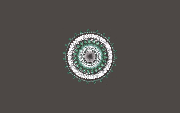 Mandala drawing with green and white geometric patterns