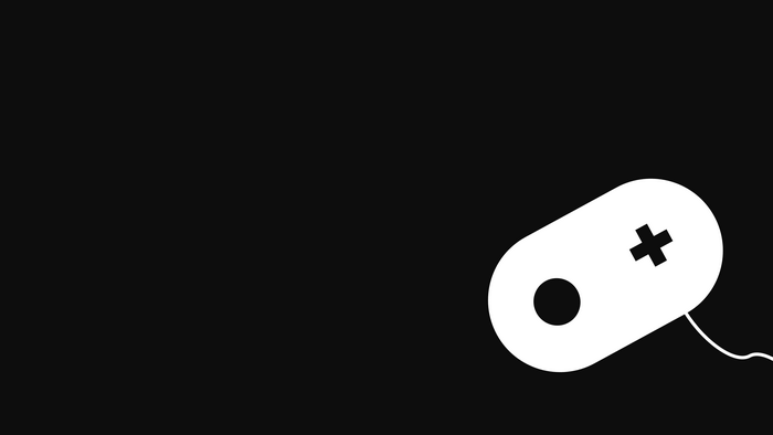 White video game controller on black background