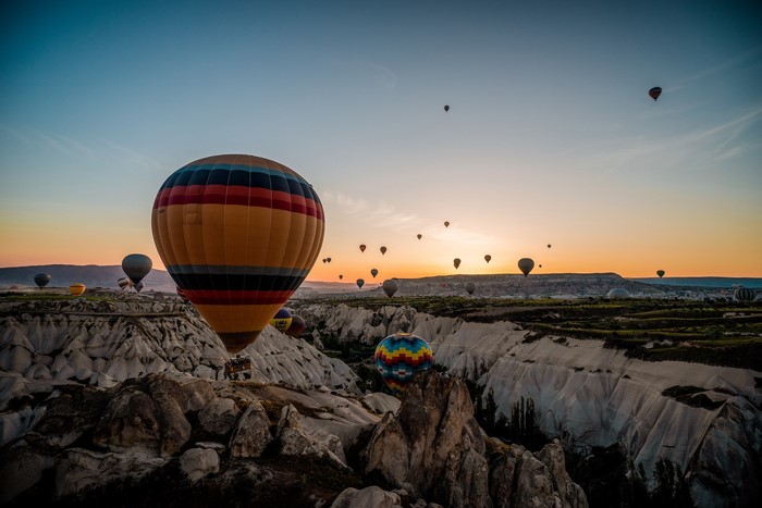 Hot air balloons over Cappadocia at sunset