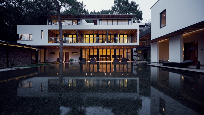 Modern house with swimming pool and reflection