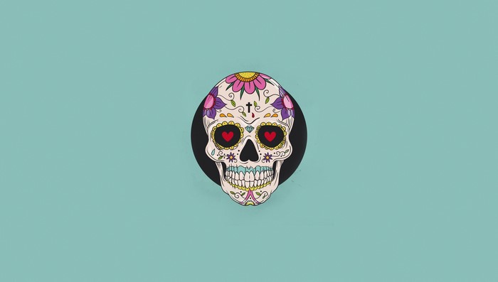 Sugar Skull with Heart Eyes on Teal Background