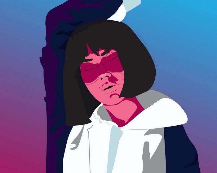 Woman with closed eyes wearing glasses