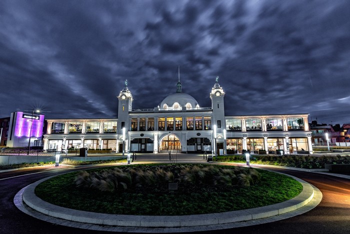 Building at night with dramatic sky