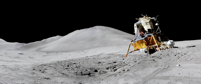 Lunar lander on the Moon's surface with hills in background