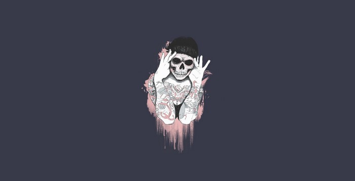 Artwork of a tattooed skull with a beanie
