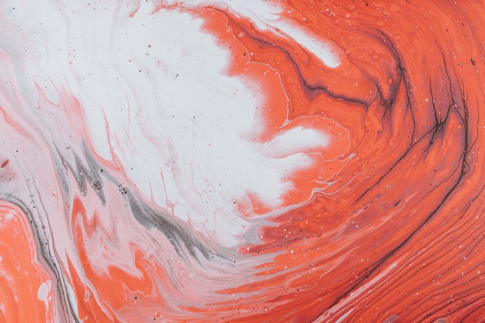 4K abstract orange and white paint splatter