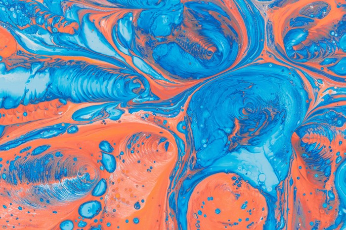 Abstract paint splatter with blue and orange
