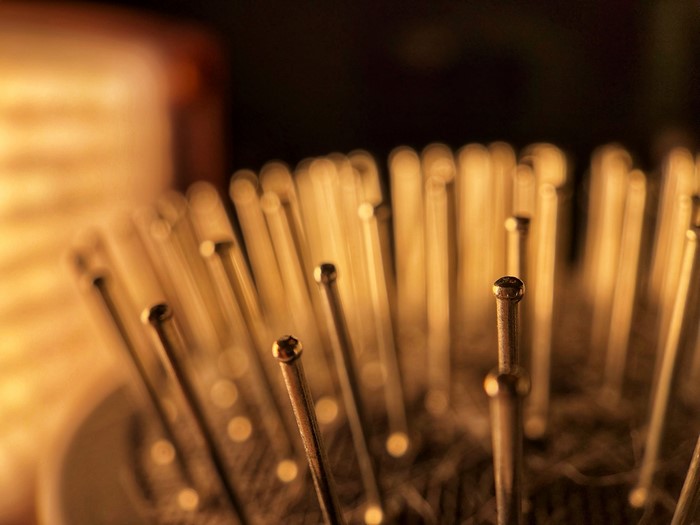 Close-up of a hairbrush with sepia bokeh