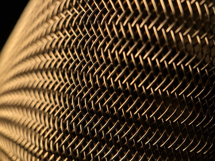 Close-up of gold woven mesh texture