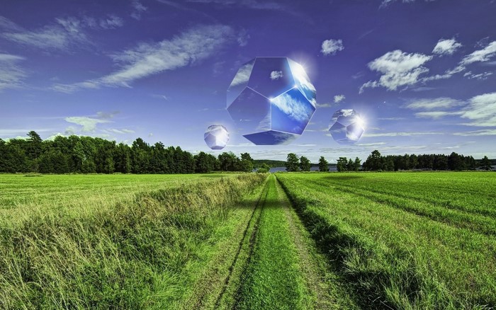 Floating geometric shapes in a landscape