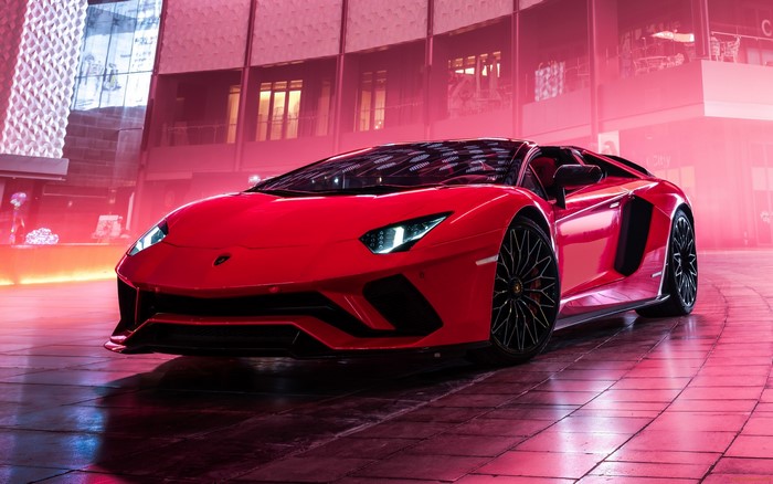 Red Lamborghini Aventador parked in a modern building