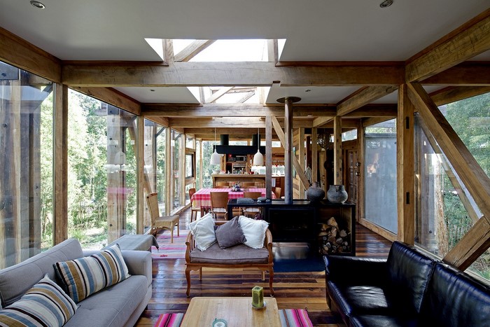Modern wooden house with large windows and fireplace