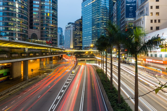 Light trails on a busy city street in Hong Kong at dusk
