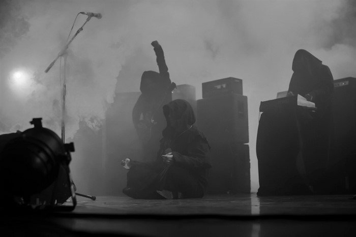 Sunn O))) performing live with smoke and speakers