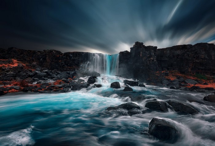 Waterfall flowing over rocks in Iceland